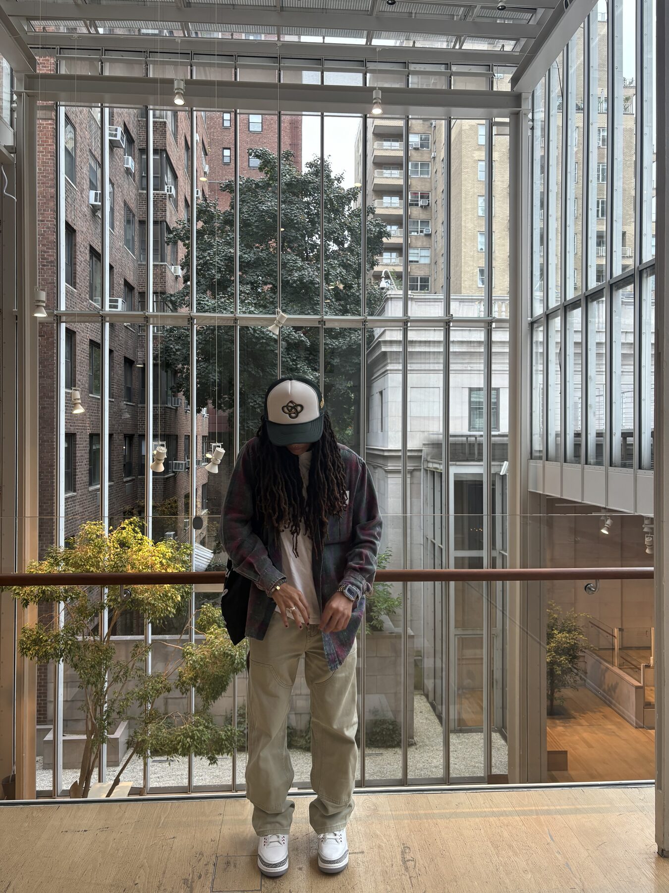 Streetwear portrait in a glass atrium