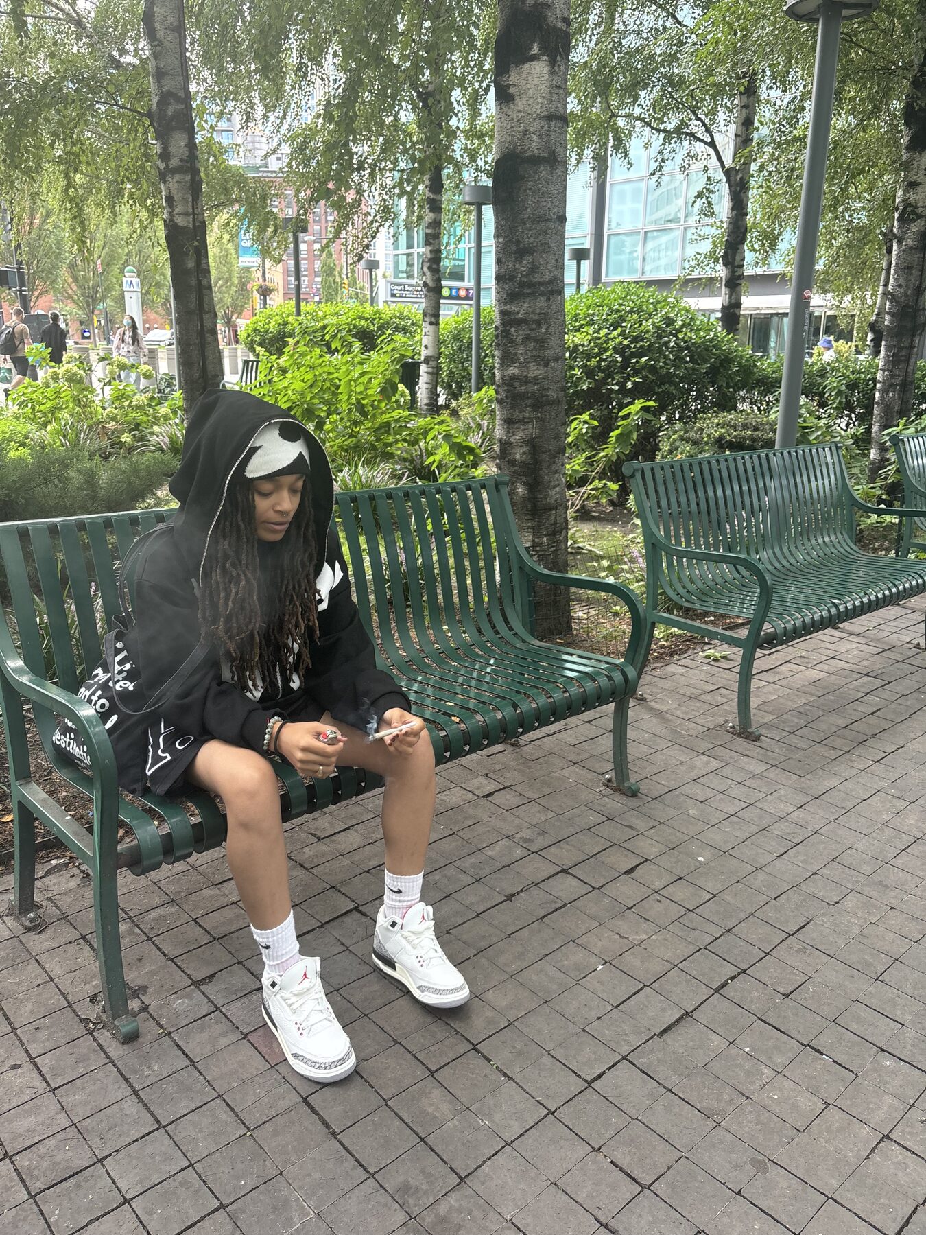 Seated outdoor streetwear portrait
